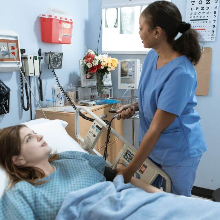 A nurse checking a patient's blood pressure in hospital