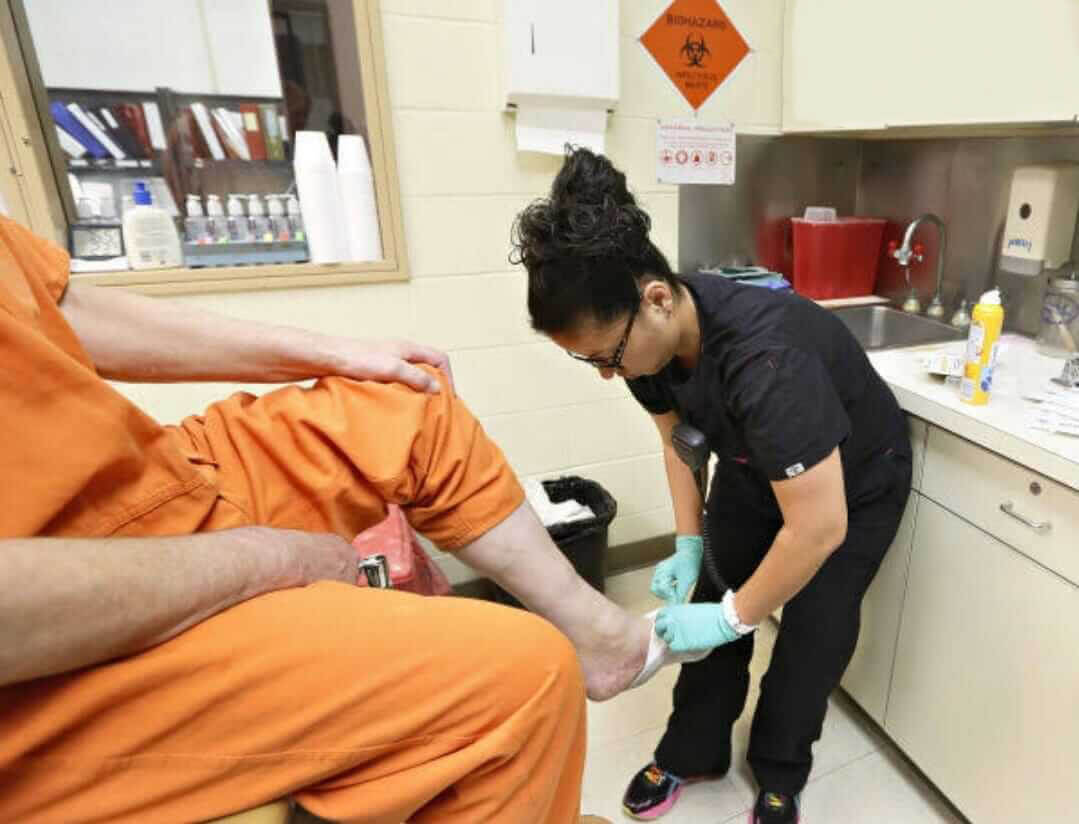 Nurse providing health care to a prisoner
